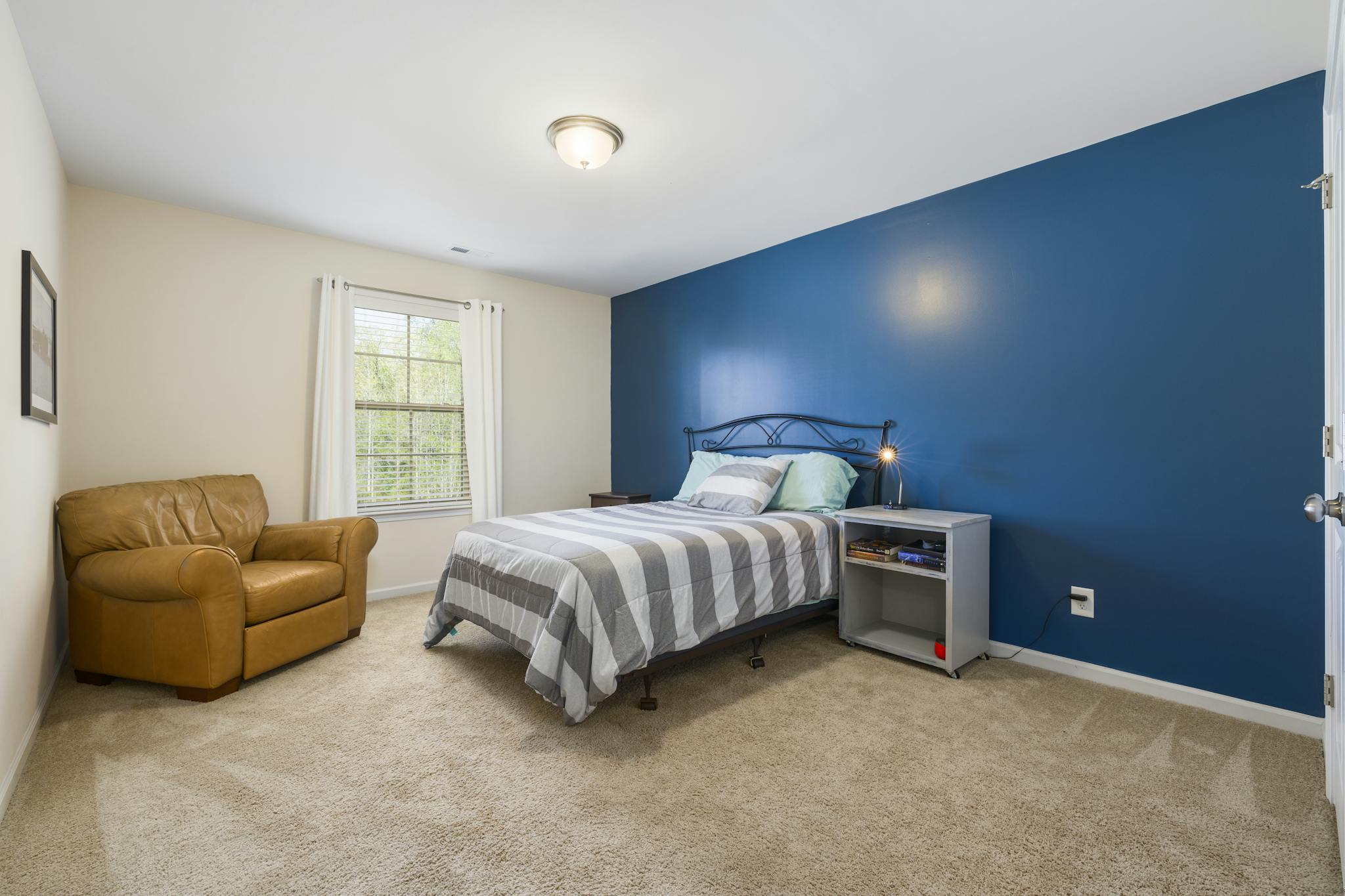bedroom with blue wall